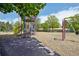Community playground in a park-like setting with slides and swings on a sunny day at 13030 King Cir, Broomfield, CO 80020