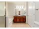 Well-lit bathroom featuring a bathtub, shower stall and dark wood cabinetry at 13456 Via Varra # 224, Broomfield, CO 80020
