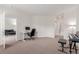 Bright bedroom featuring a desk, computer and an adjacent living area, perfect for work or relaxation at 13456 Via Varra # 224, Broomfield, CO 80020