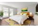 Well-lit bedroom featuring a comfortable queen bed, stylish decor, and a warm, inviting atmosphere at 13456 Via Varra # 224, Broomfield, CO 80020