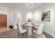 Bright dining room with stylish round table and chairs, perfect for intimate meals at 13456 Via Varra # 224, Broomfield, CO 80020