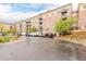 Attractive condominium exterior with multiple units, balconies, and ample parking spaces at 13456 Via Varra # 224, Broomfield, CO 80020