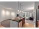 Open kitchen with breakfast bar, stainless steel appliances, and seamless flow into the living area at 13456 Via Varra # 224, Broomfield, CO 80020