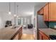 Open concept kitchen featuring a stainless refrigerator and views of the living area at 13456 Via Varra # 224, Broomfield, CO 80020