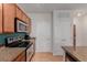 Well-equipped kitchen showcasing stainless steel appliances and ample cabinet space at 13456 Via Varra # 224, Broomfield, CO 80020