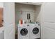 A practical laundry room features a side by side washer and dryer and ample storage at 13456 Via Varra # 224, Broomfield, CO 80020
