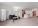Spacious living room featuring a modern kitchen, stainless steel appliances, and ample natural light at 13456 Via Varra # 224, Broomfield, CO 80020