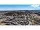 Expansive aerial of a suburban community nestled among rolling hills and native landscapes at 5078 Zion Ct, Castle Rock, CO 80109
