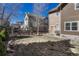 Backyard with grassy area, wooden fence, and exterior of the home at 5078 Zion Ct, Castle Rock, CO 80109