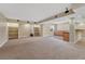 Spacious basement with built-in shelves, carpet flooring, and wet bar area at 5078 Zion Ct, Castle Rock, CO 80109