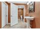 Bathroom featuring single sink, toilet, and tile flooring at 5078 Zion Ct, Castle Rock, CO 80109