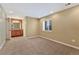Bedroom with a window and adjoining bathroom featuring granite countertop at 5078 Zion Ct, Castle Rock, CO 80109