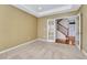 Bedroom featuring carpet flooring, neutral paint and double doors to hallway at 5078 Zion Ct, Castle Rock, CO 80109