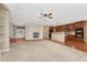 Spacious living room with fireplace, hardwood floors, carpet, built in shelving and view of the kitchen at 5078 Zion Ct, Castle Rock, CO 80109