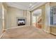 Living room with fireplace and carpet and view into staircase and secondary rooms at 5078 Zion Ct, Castle Rock, CO 80109