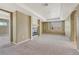 Spacious living room with cozy fireplace, neutral carpet, and ample natural light at 5078 Zion Ct, Castle Rock, CO 80109