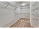 A walk-in closet with carpeted floor and metal shelving throughout at 5078 Zion Ct, Castle Rock, CO 80109