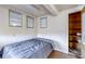 Cozy bedroom with a queen size bed, accent lighting and a doorway leading to a bright sauna at 3653 S Flanders St, Aurora, CO 80013