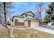 Charming two-story home with brick accents, attached garage, and well-maintained front yard in a quiet neighborhood at 3653 S Flanders St, Aurora, CO 80013
