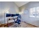 A dedicated home office with natural light, multiple monitors, and comfortable seating enhances productivity at 3653 S Flanders St, Aurora, CO 80013