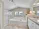 A luxurious bathroom with a walk-in shower, garden tub, and granite countertops at 9845 Glenstone Trl, Highlands Ranch, CO 80130