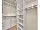Organized walk-in closet with shelving and racks, providing ample storage space at 9845 Glenstone Trl, Highlands Ranch, CO 80130