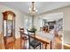 Traditional dining room with hardwood floors, chandelier, and classic furnishings at 9845 Glenstone Trl, Highlands Ranch, CO 80130