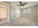 Bedroom with neutral walls, carpet, closet and ceiling fan at 16503 E Yale Pl, Aurora, CO 80013