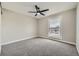 Bedroom with neutral walls, carpet, large window and ceiling fan at 16503 E Yale Pl, Aurora, CO 80013