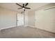 Bedroom featuring neutral walls, carpet, closet and ceiling fan at 16503 E Yale Pl, Aurora, CO 80013