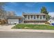 Charming two-story home with a well-manicured lawn, garage, and neutral colored siding at 16503 E Yale Pl, Aurora, CO 80013