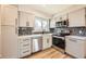 Well-lit kitchen features sleek stainless appliances, plenty of cabinets, and a modern backsplash at 16503 E Yale Pl, Aurora, CO 80013