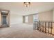 Open living area features neutral tones, lots of light, and easy access to the staircase at 16503 E Yale Pl, Aurora, CO 80013