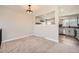 Inviting living room showcases fresh paint, modern lighting, and an open view into the kitchen at 16503 E Yale Pl, Aurora, CO 80013