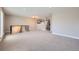 Bright, open living room features fresh paint, neutral carpet, and a light fixture at 16503 E Yale Pl, Aurora, CO 80013
