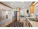 Open kitchen featuring stainless steel appliances and an adjacent dining area at 509 Newland St, Lakewood, CO 80226