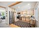 Bright kitchen with stainless steel appliances, wood floors and a window-side coffee bar at 509 Newland St, Lakewood, CO 80226