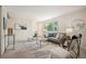 Spacious living room with modern furnishings, neutral colors, and ample natural light at 509 Newland St, Lakewood, CO 80226