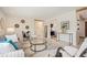 Bright living room featuring modern decor, stylish furnishings, and a view into the adjacent kitchen at 509 Newland St, Lakewood, CO 80226
