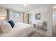 Cozy main bedroom with soft carpeting, large windows, and accent lighting at 509 Newland St, Lakewood, CO 80226