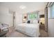 Serene bedroom with a plush bed, soft lighting, and neutral decor for a relaxing ambiance at 509 Newland St, Lakewood, CO 80226