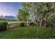 Backyard featuring a wooden playset, lush lawn and mature trees at 16667 Tin Cup Ct, Parker, CO 80134