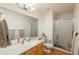 Well-lit bathroom features a large mirror, white walls, and a glass-enclosed shower at 16667 Tin Cup Ct, Parker, CO 80134