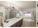 Well-lit bathroom featuring a double sink vanity, soaking tub, and glass shower at 16667 Tin Cup Ct, Parker, CO 80134