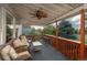 Relaxing outdoor deck with comfortable seating, a ceiling fan and scenic views at 16667 Tin Cup Ct, Parker, CO 80134