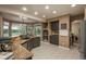 Open kitchen with granite countertops, tile flooring, stainless steel appliances and a bay window providing lots of natural light at 16667 Tin Cup Ct, Parker, CO 80134