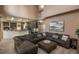 Large living room with a sectional sofa, high ceilings, neutral decor, open floor plan, and access to the kitchen at 16667 Tin Cup Ct, Parker, CO 80134