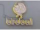 Stylish Birdcall sign with a whimsical bird design, enhancing the restaurant's curb appeal at 2737 N Marion St, Denver, CO 80205