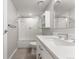 Modern bathroom with white subway tiles and a quartz vanity at 13800 E Marina Dr # 210, Aurora, CO 80014