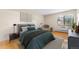 Bright bedroom with hardwood floors and window at 13800 E Marina Dr # 210, Aurora, CO 80014